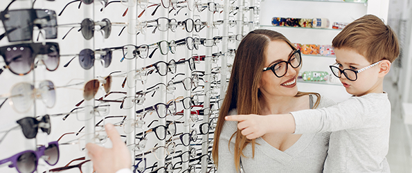 Choosing designer frames at the Eyedoctor optical in Orleans