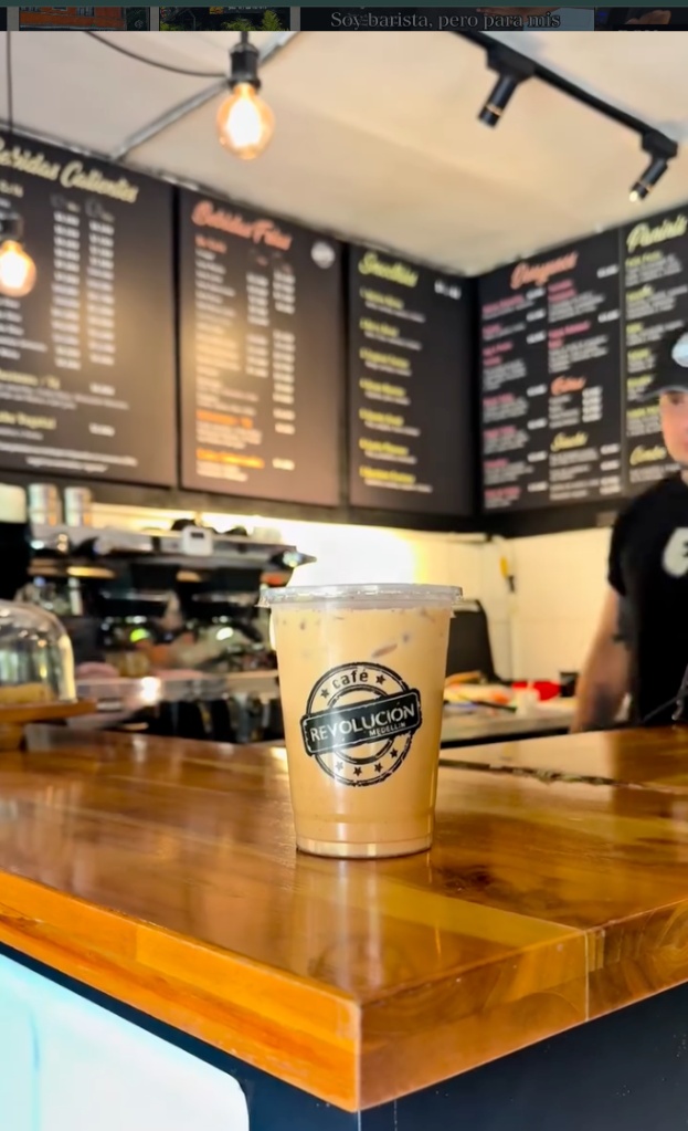 The coffee corner · iced coffee on a warm wood counter